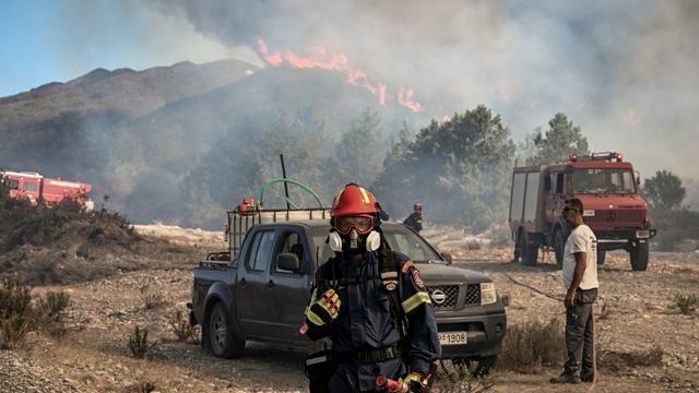 Greece fires force more evacuations from Rhodes and other islands as a new heat wave bears down