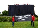 Climate activists drape UK PM Sunak's home in black to protest oil expansion