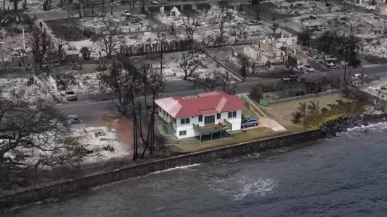 Red roofed house in Maui miraculously remains unscathed after Hawaii wildfires