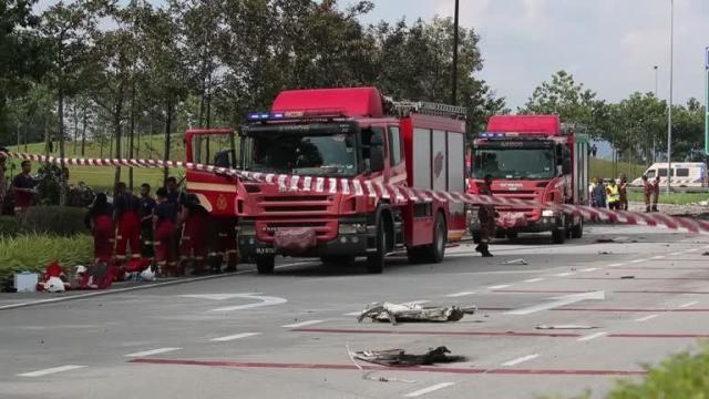 At least 10 dead after plane crashes into highway in Malaysia