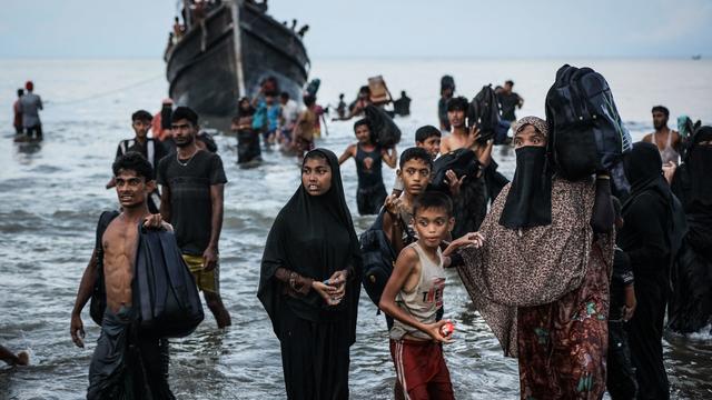 Boat crammed with Rohingya refugees, including women and children, sent back to sea in Indonesia