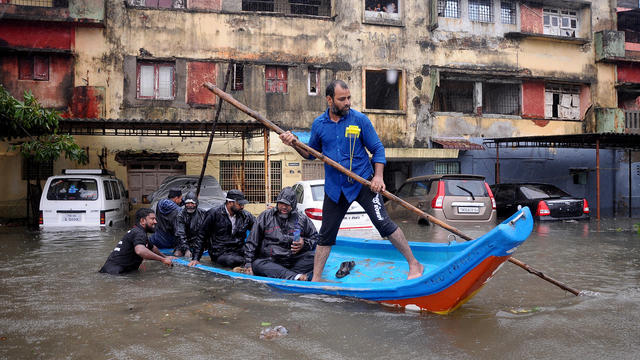 Cyclone Michaung flooding inundates Chennai airport in India as cars are swept down streets