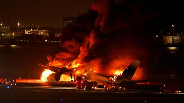 5 dead, hundreds evacuated after Japan Airlines jet and coast guard plane collide at Tokyo's Haneda Airport