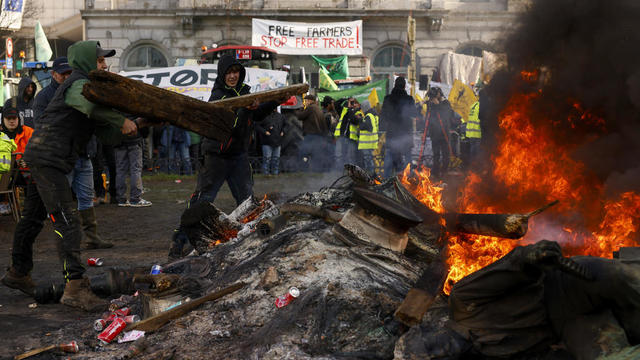 European farmers rage at EU parliament in Brussels, but France protests called off after 2 weeks of mayhem