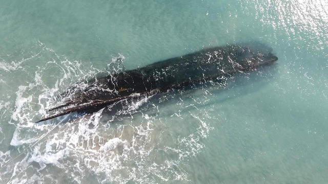 Mysterious shipwreck washes up on snowy Canada shores, prompting race to salvage vessel being "pummeled by the ocean"