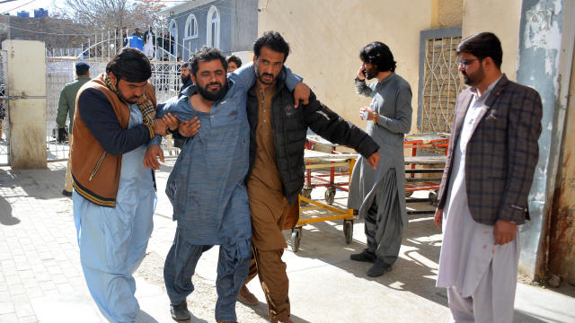 Pakistan election offices hit by twin bombings, killing at least 24 people a day before parliamentary vote