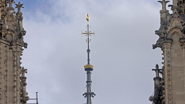 Notre Dame's new spire revealed in Paris, marking a milestone in cathedral's reconstruction after fire