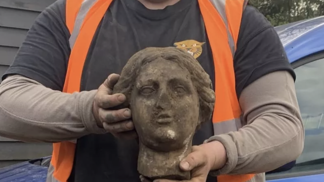 Ancient statue unearthed during parking lot construction: "A complete mystery"