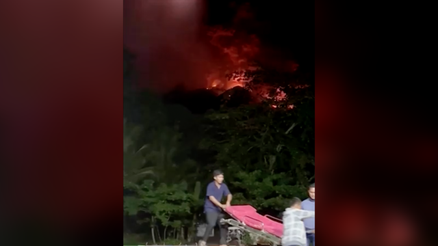 Days-long eruption of Indonesia's Ruang volcano forces hundreds to evacuate as sky fills with red ash