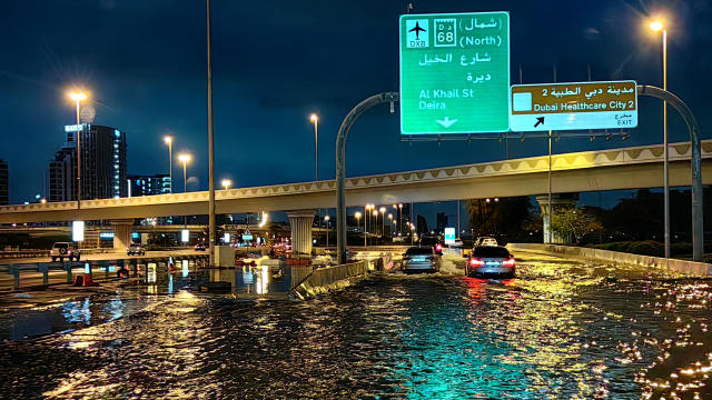 Dubai flooding hobbles major airport's operations as "historic weather event" brings torrential rains to UAE