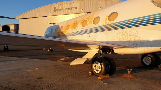 Climate activists arrested for spray-painting private jets orange at London airport