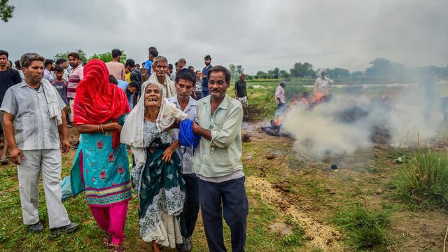 Indian officials order investigation into deadly stampede, search for religious leader as death toll hits 121