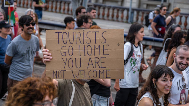 Spanish anti-tourism protesters take aim at Barcelona visitors with water guns