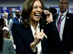 Harris caught on camera having a fake conversation, flashes phone to reveal